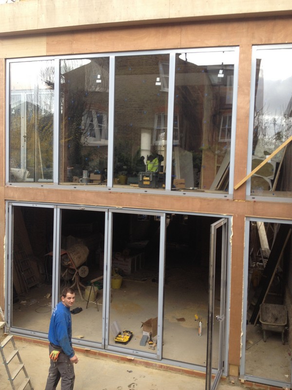 Aluminium bi-fold doors with two-storey glazing in Herne Hill