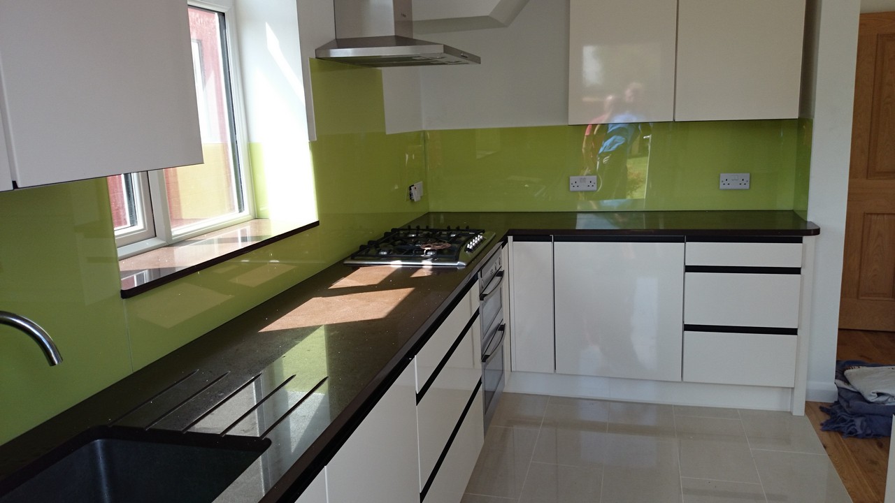 Lime green glass kitchen splashback installed by Herne Hill glaziers